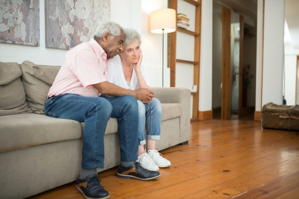 An Elderly Couple Grieving a Loss